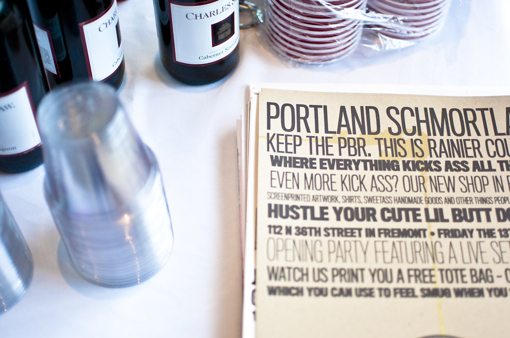 Portland Schmortland opening flier with wine bottles on table