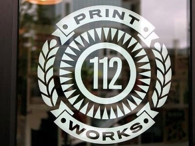 112 PrintWorks logo etched on front door glass